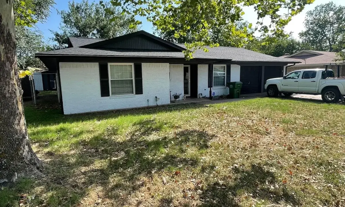 Professional roofing crew working on a residential roof in Elizabeth